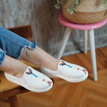A white sneaker with square Arrows