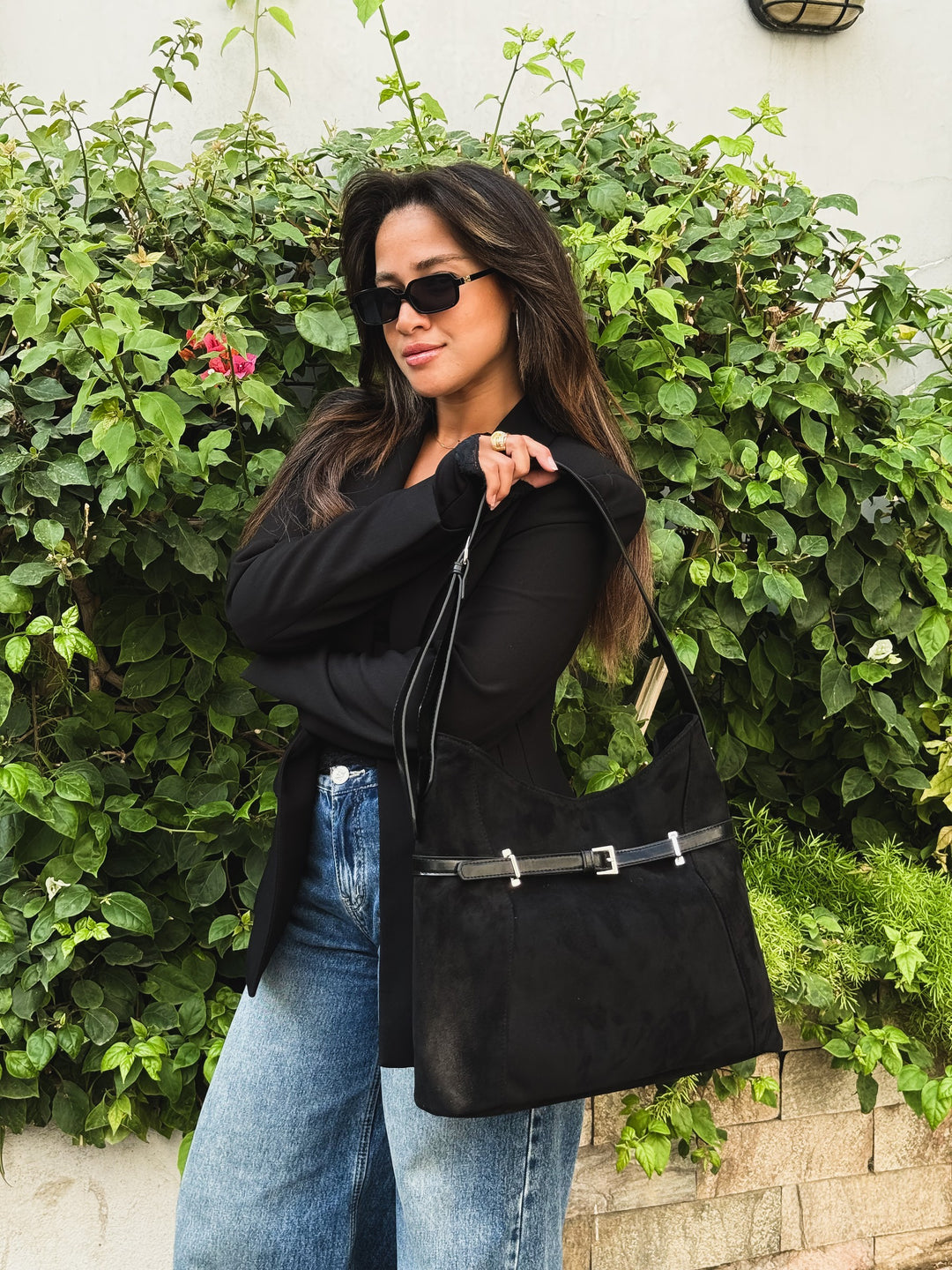 Black belted slouch shoulder bag faux suede – worn on model (3)