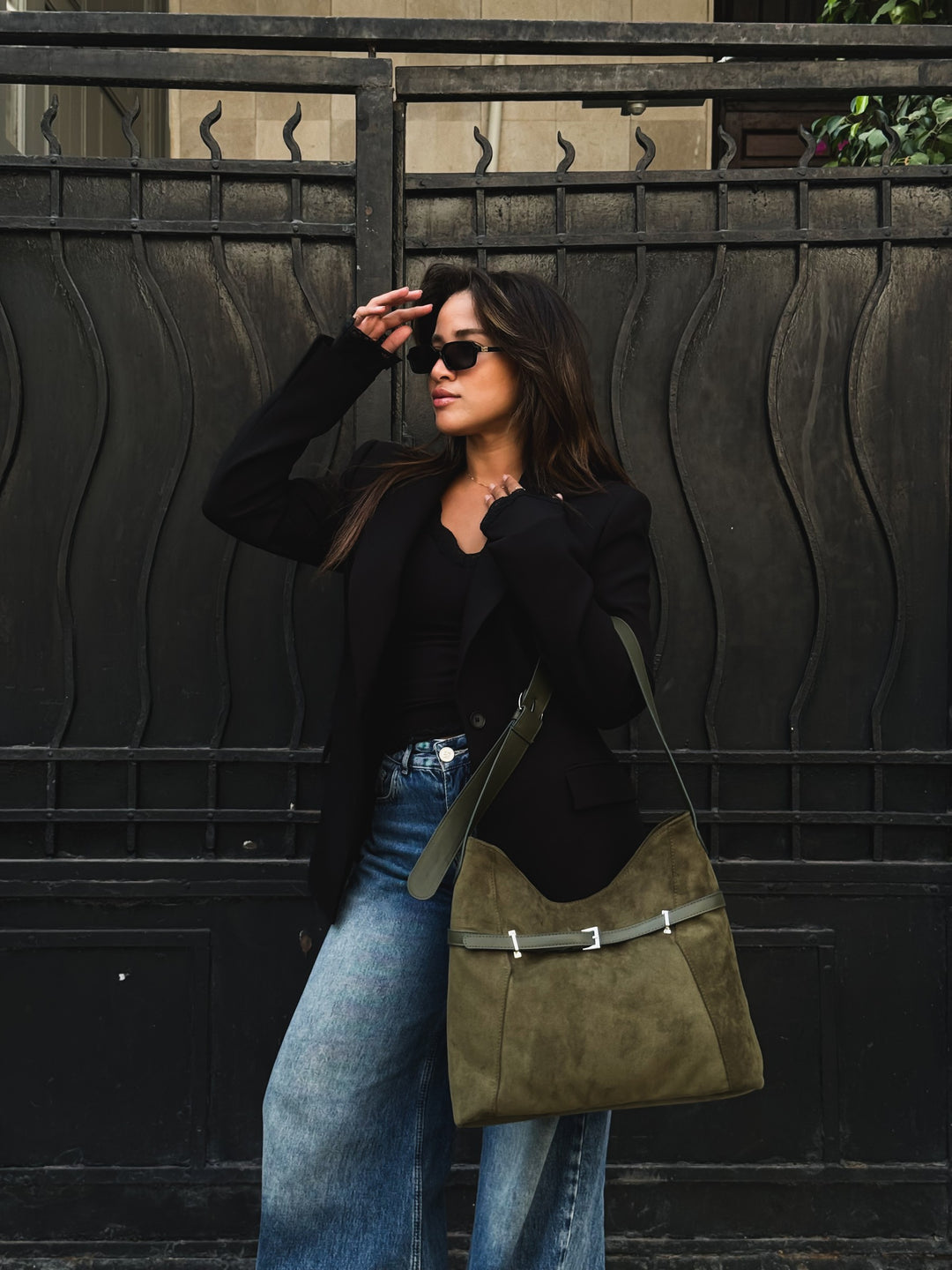 Olive belted slouch shoulder bag faux suede – worn on model (4)