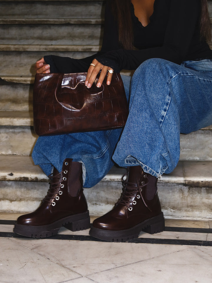 Dark Brown croc-embossed ruched clutch faux leather – worn on model (2)
