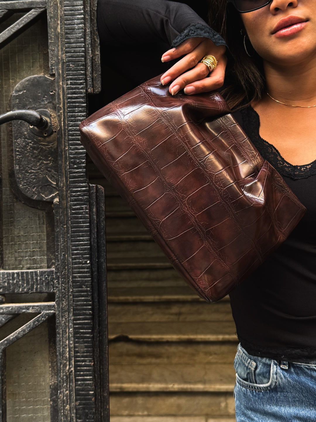 Dark Brown croc-embossed ruched clutch faux leather – worn on model (3)