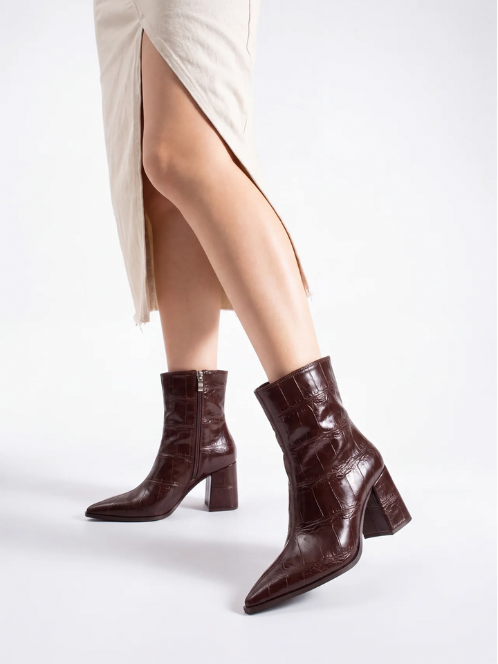 Brown croc-embossed block heel ankle boot faux leather – worn on model, walking