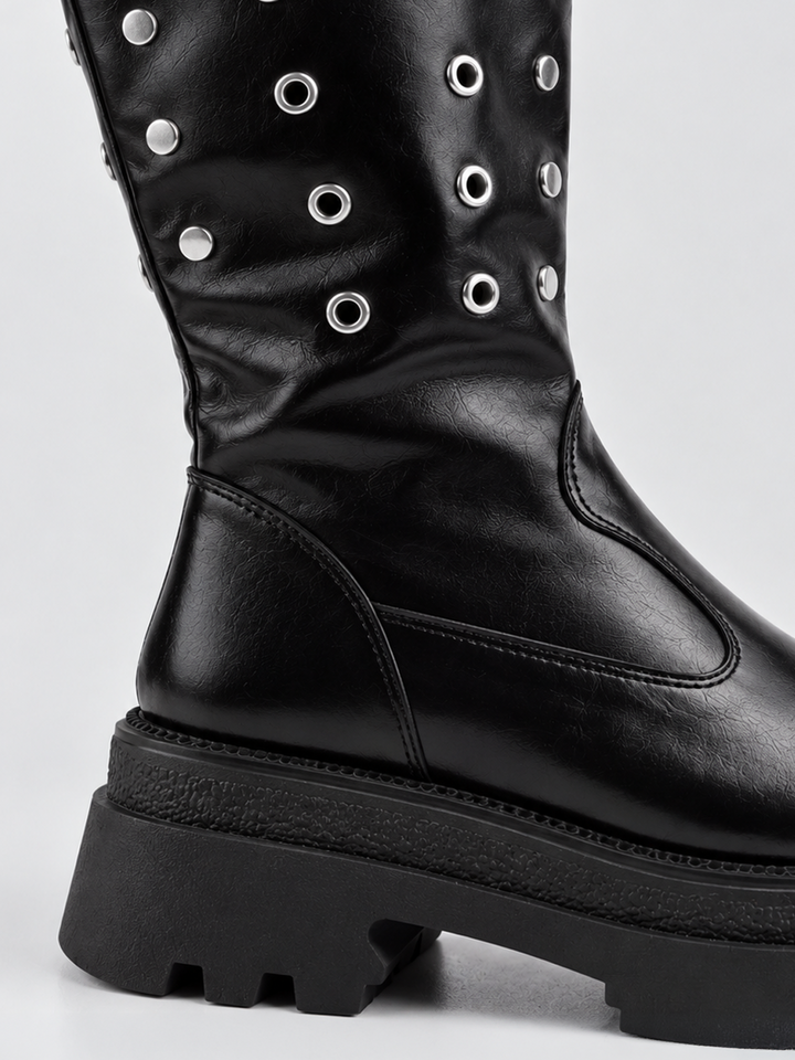 Black faux leather eyelet platform mid-calf boot – back heel and lug sole close-up