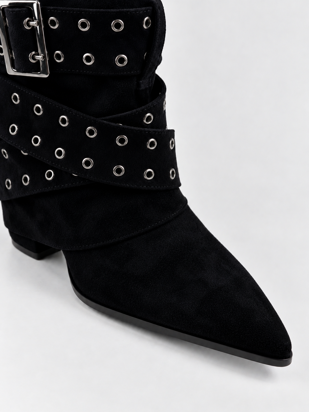 Black faux suede buckle strap slouch ankle boot – pointed toe close-up