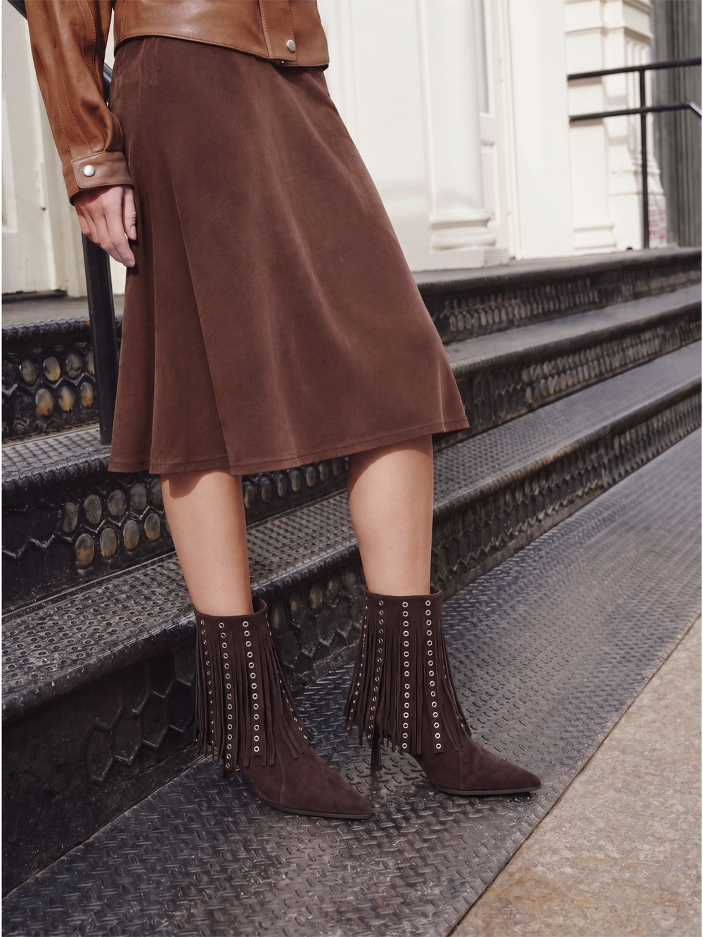 Brown faux suede fringe heeled ankle boot – full outfit on model with midi skirt