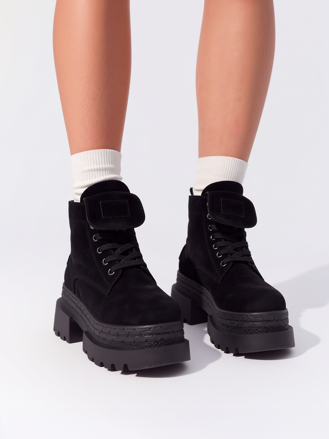 Black pocket lace-up platform ankle boot faux suede – worn on model with white socks, front view