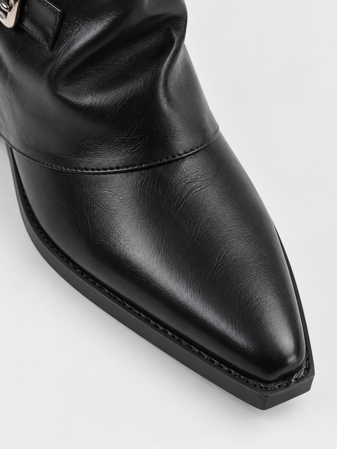 Black fold-over buckle ankle boot faux leather – pointed toe close-up