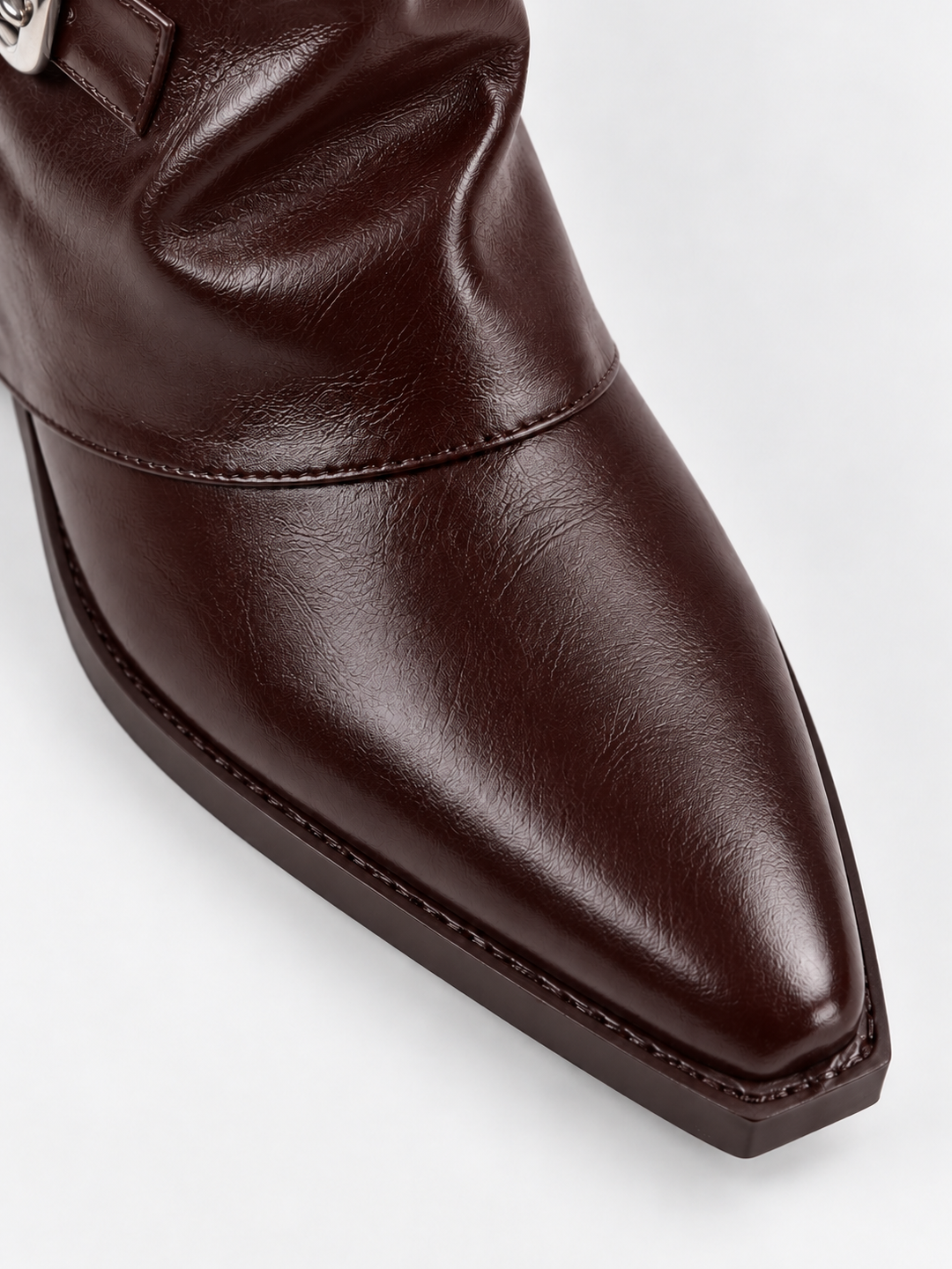 Brown fold-over buckle ankle boot faux leather – pointed toe close-up