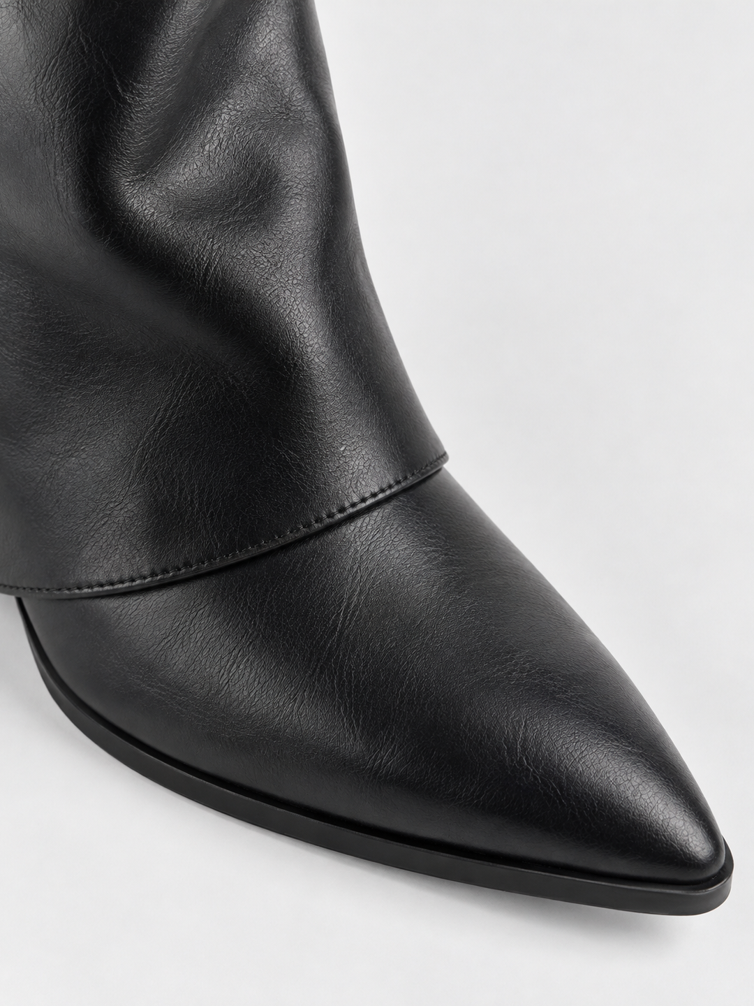 Black fold-over gold bar ankle boot faux leather – pointed toe close-up
