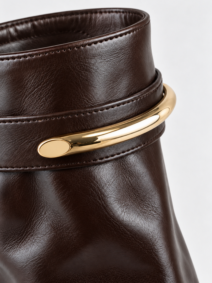 Brown fold-over gold bar ankle boot faux leather – gold-tone bar close-up