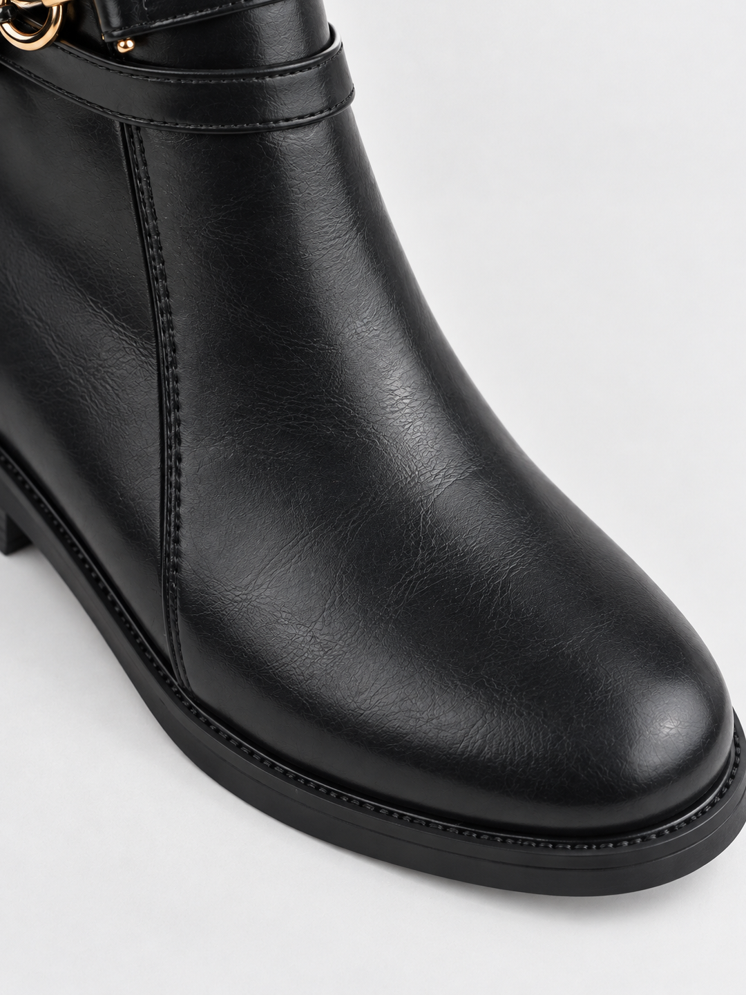 Black horsebit strap ankle boot faux leather – round toe close-up