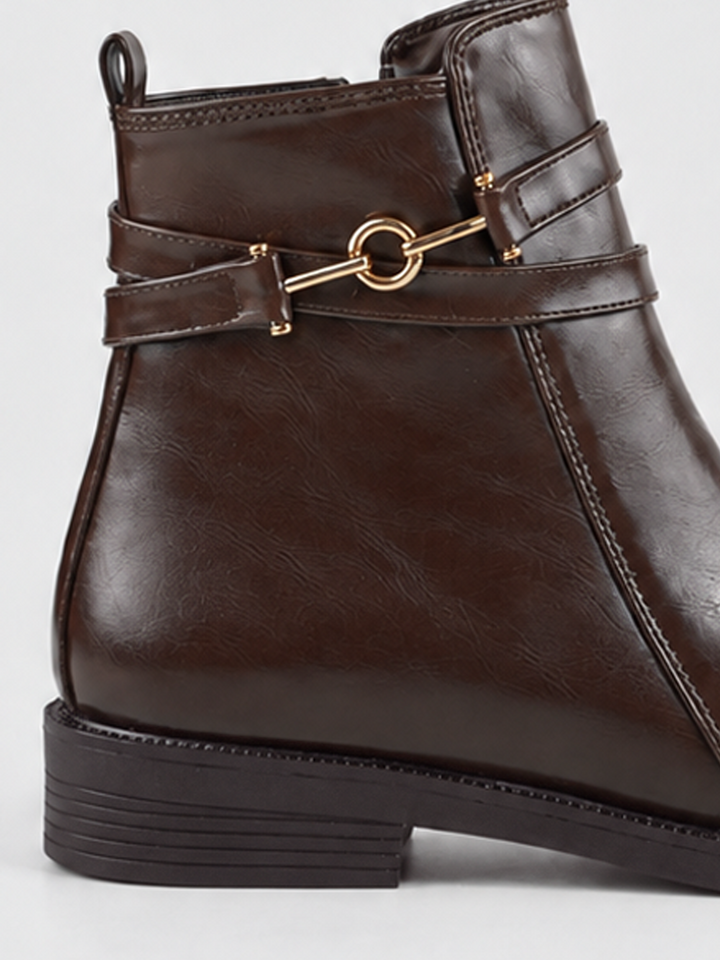 Brown horsebit strap ankle boot faux leather – horsebit strap and heel close-up