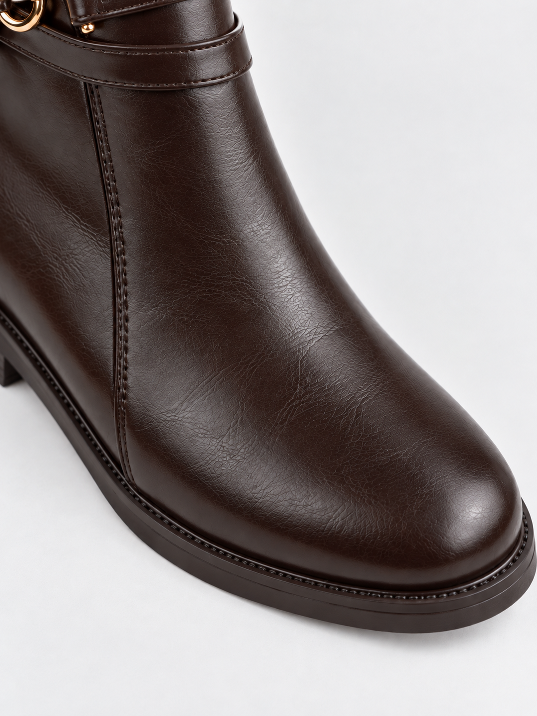Brown horsebit strap ankle boot faux leather – round toe close-up