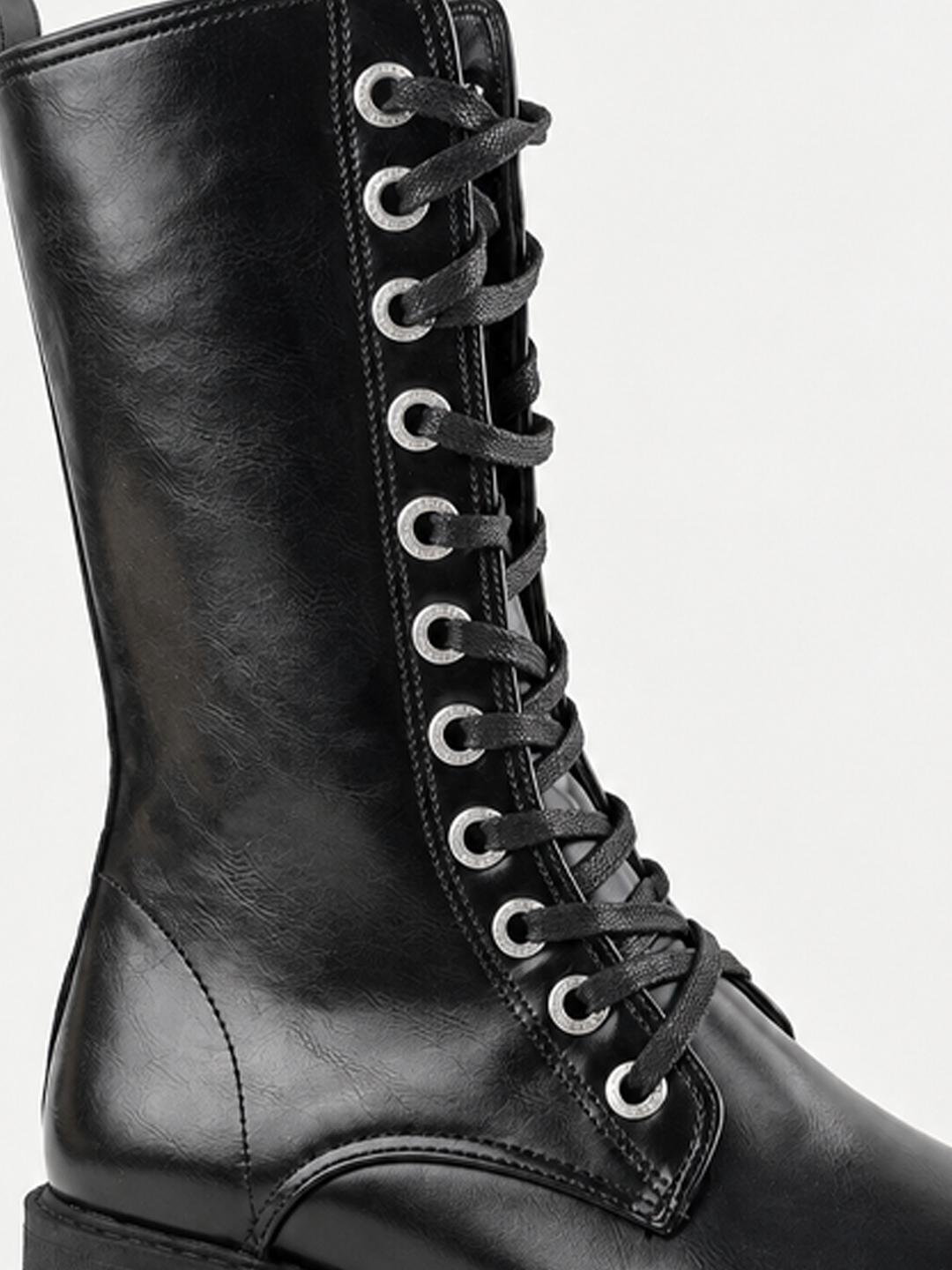 Black mid-calf lace-up combat boot faux leather – laces and eyelets close-up