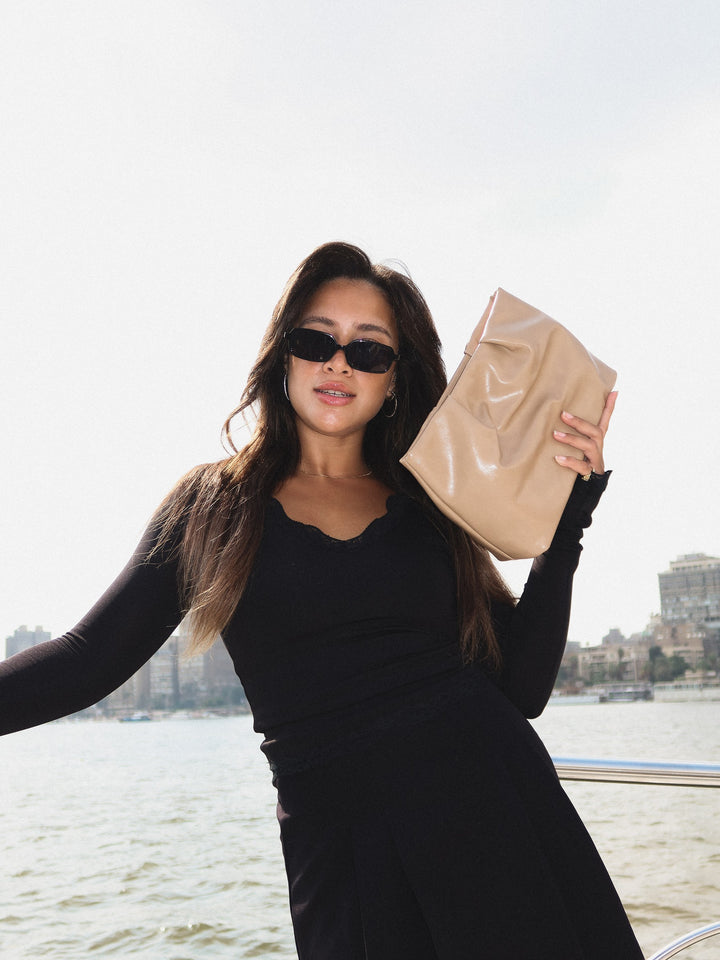 Beige ruched pouch clutch faux leather – worn on model (8)