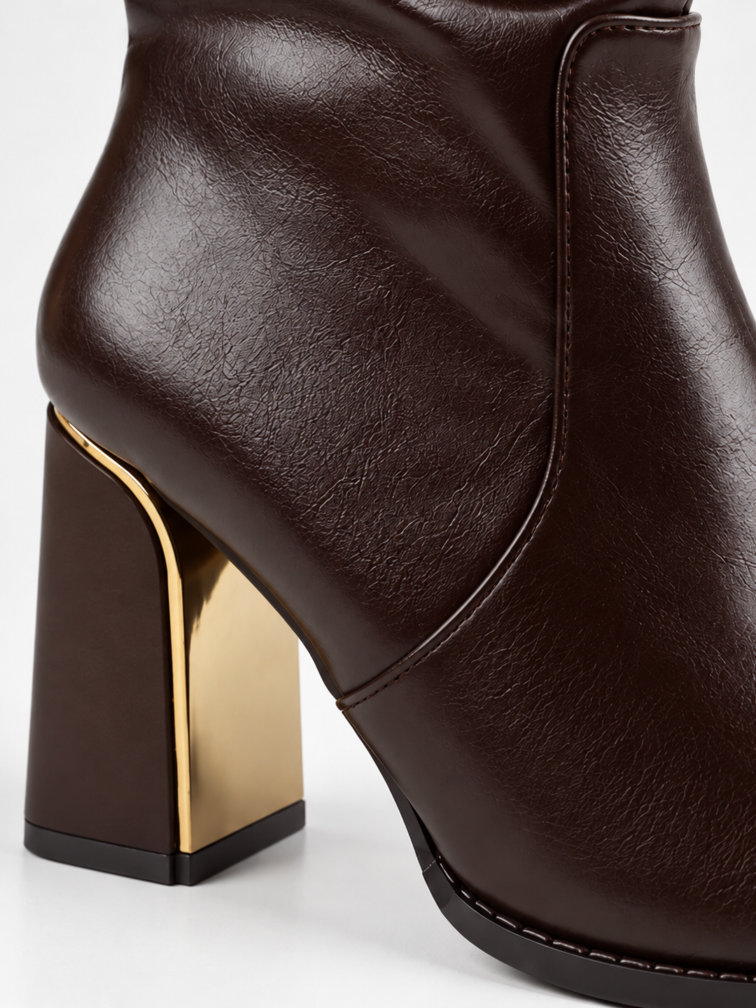 Brown slouchy metal-trim block heel ankle boot faux leather – block heel close-up