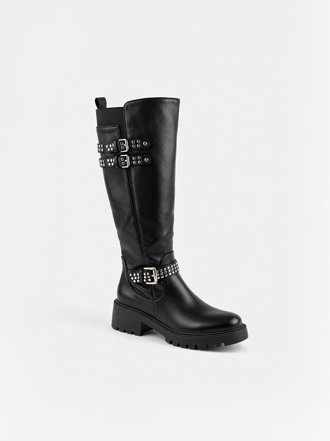 Black studded strap knee-high riding boot faux leather – front three-quarter view