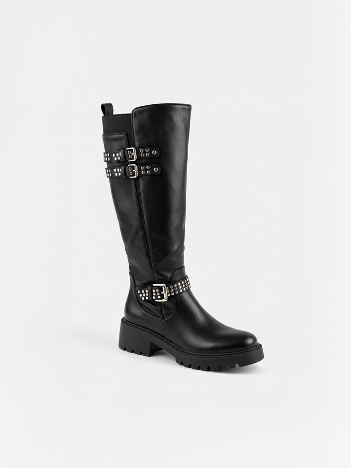 Black studded strap knee-high riding boot faux leather – front three-quarter view