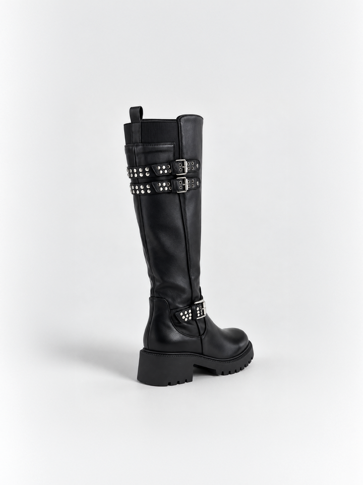 Black studded strap knee-high riding boot faux leather – back three-quarter view