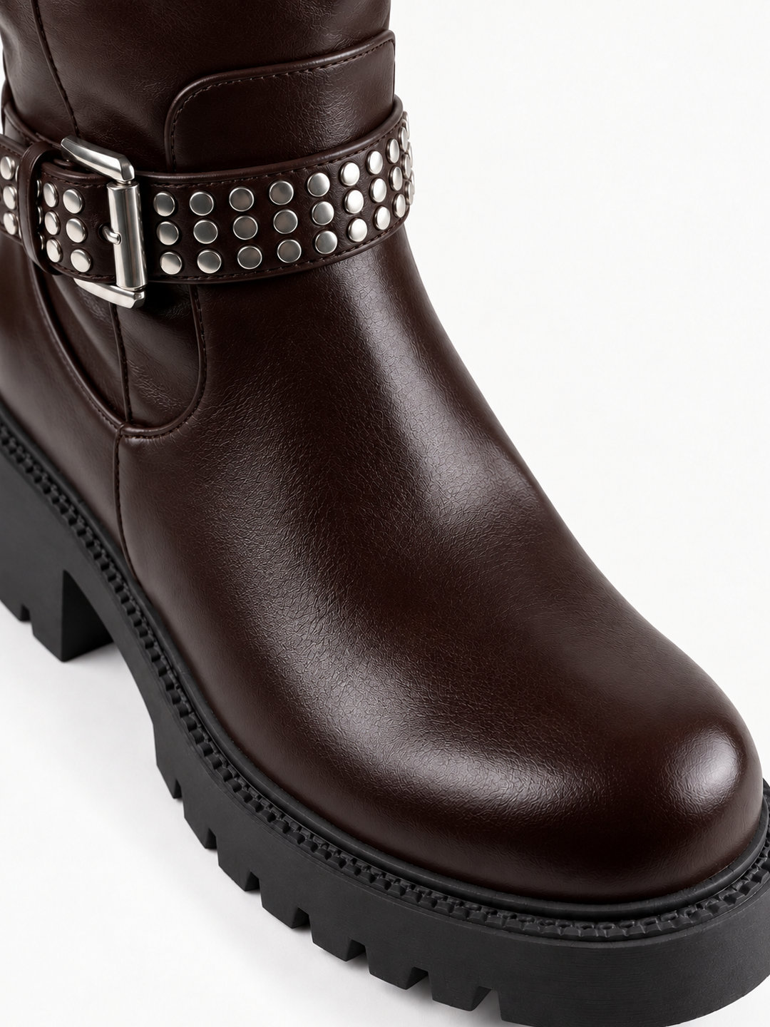 Brown studded strap knee-high riding boot faux leather – round toe and lug sole close-up