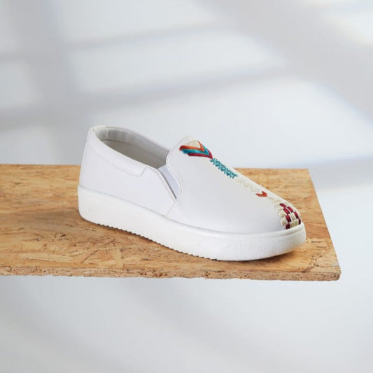 A white sneaker with square Arrows