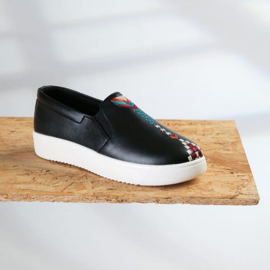 A Black Sneaker with square Arrows