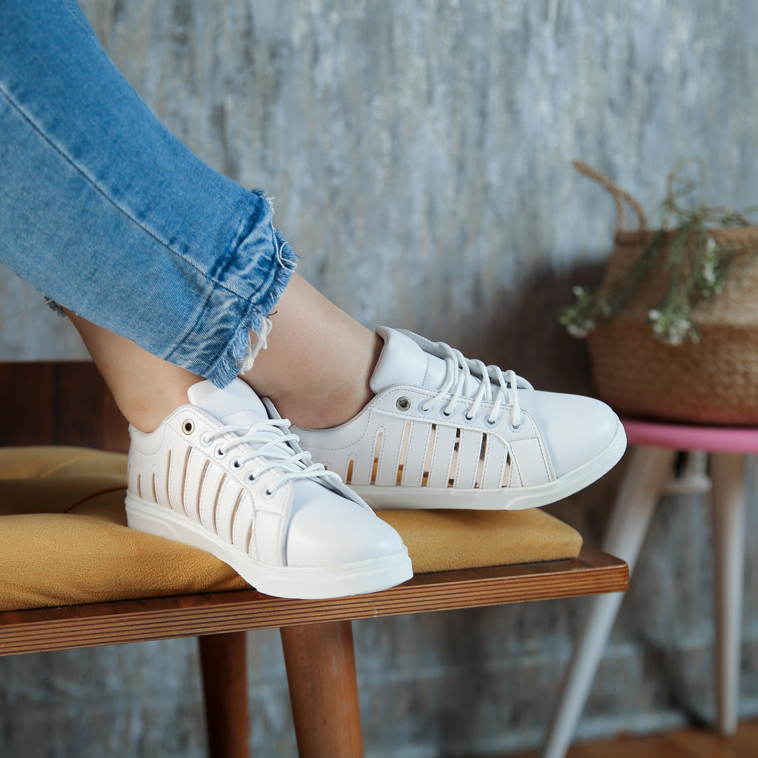 white sneaker with Gold lines