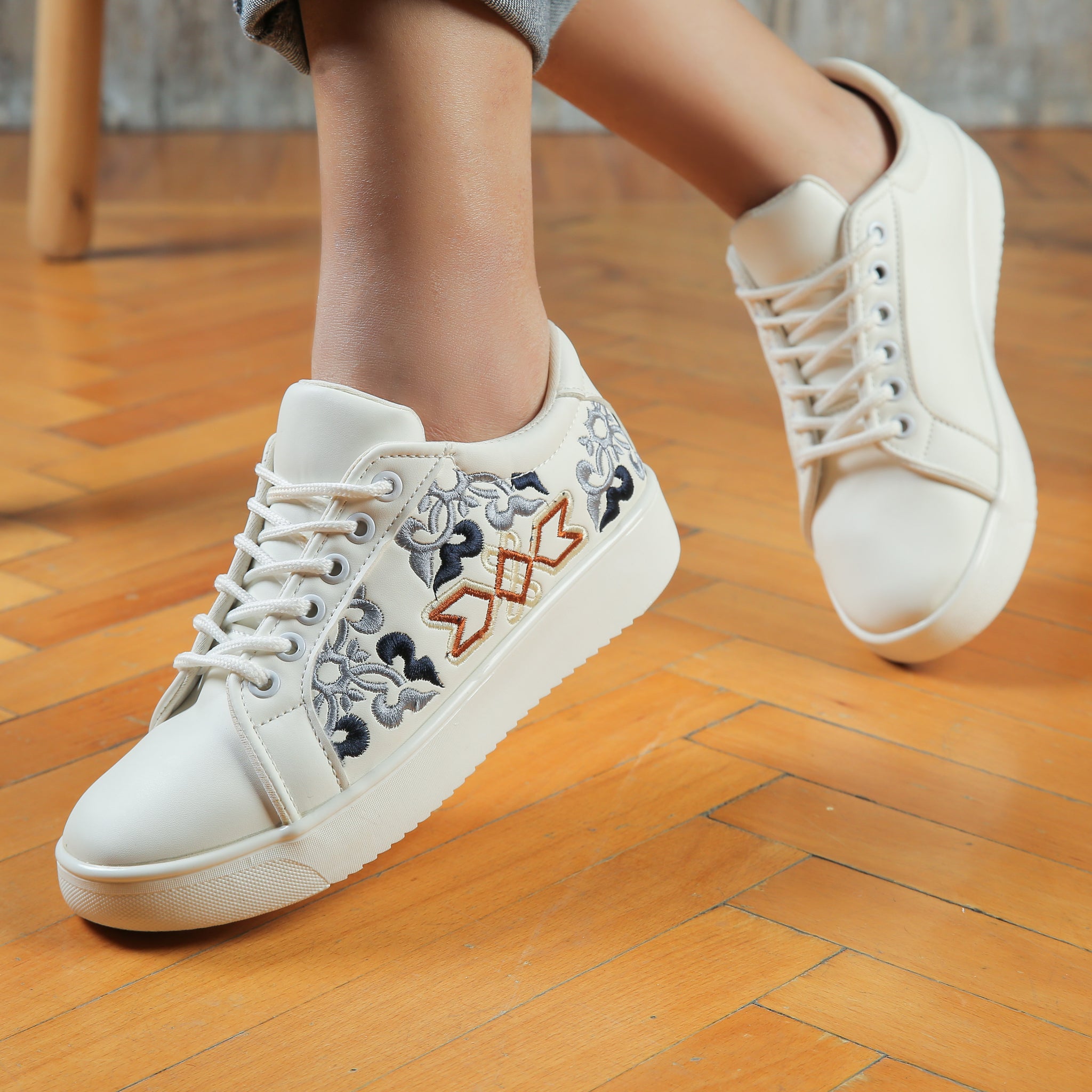 White sneakers with wings